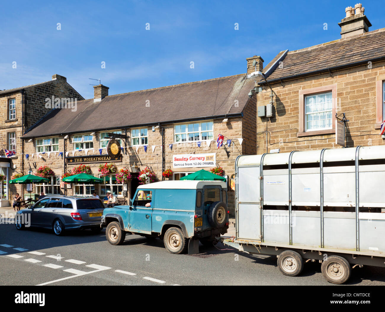 Bakewell town centre traffic with a farmer on his way to market Derbyshire Peak District England UK GB EU Europe Stock Photo