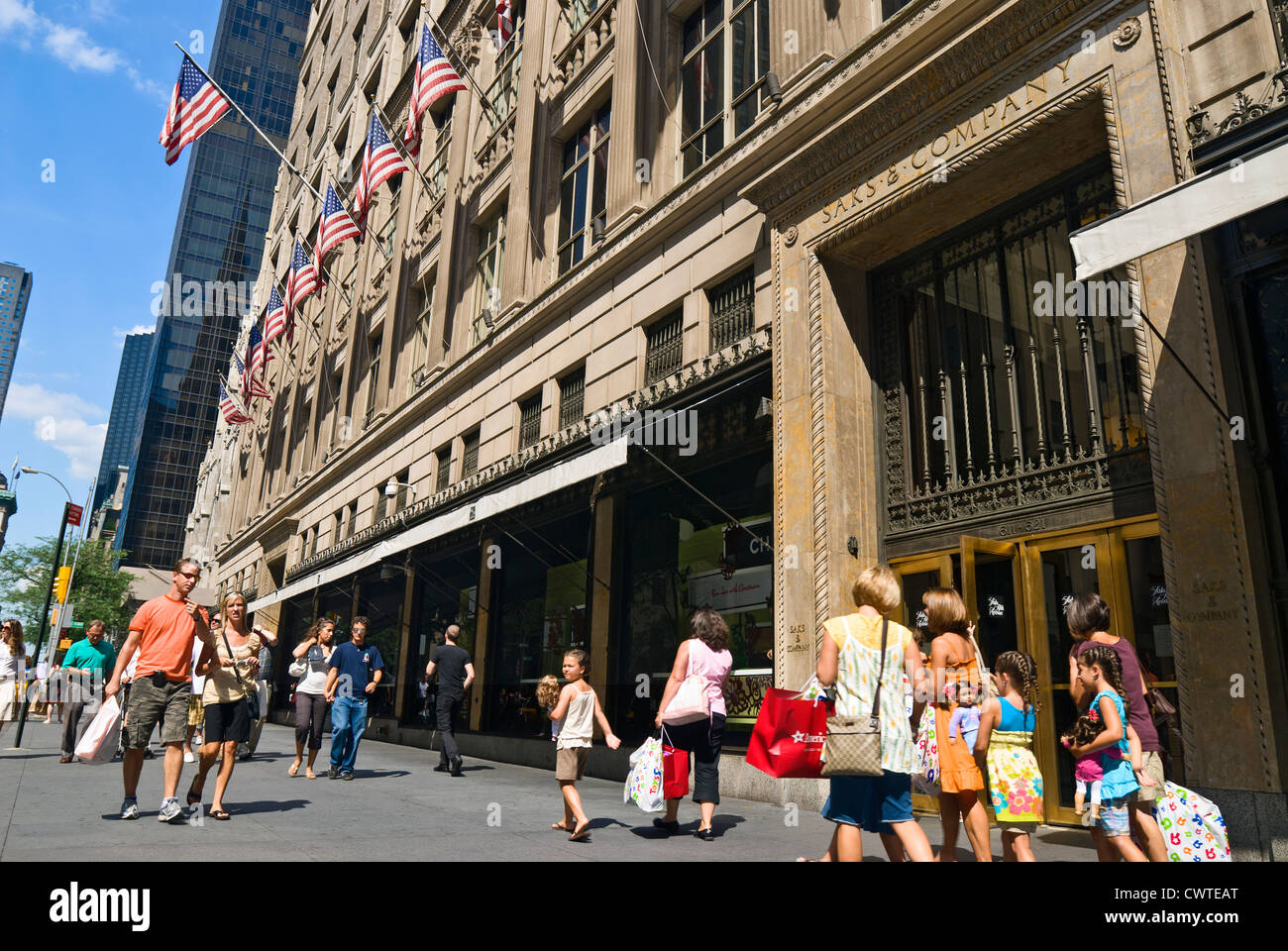 Saks Fifth Avenue Department Store and crowd of shoppers and tourists, Fifth Avenue, New York City. Stock Photo