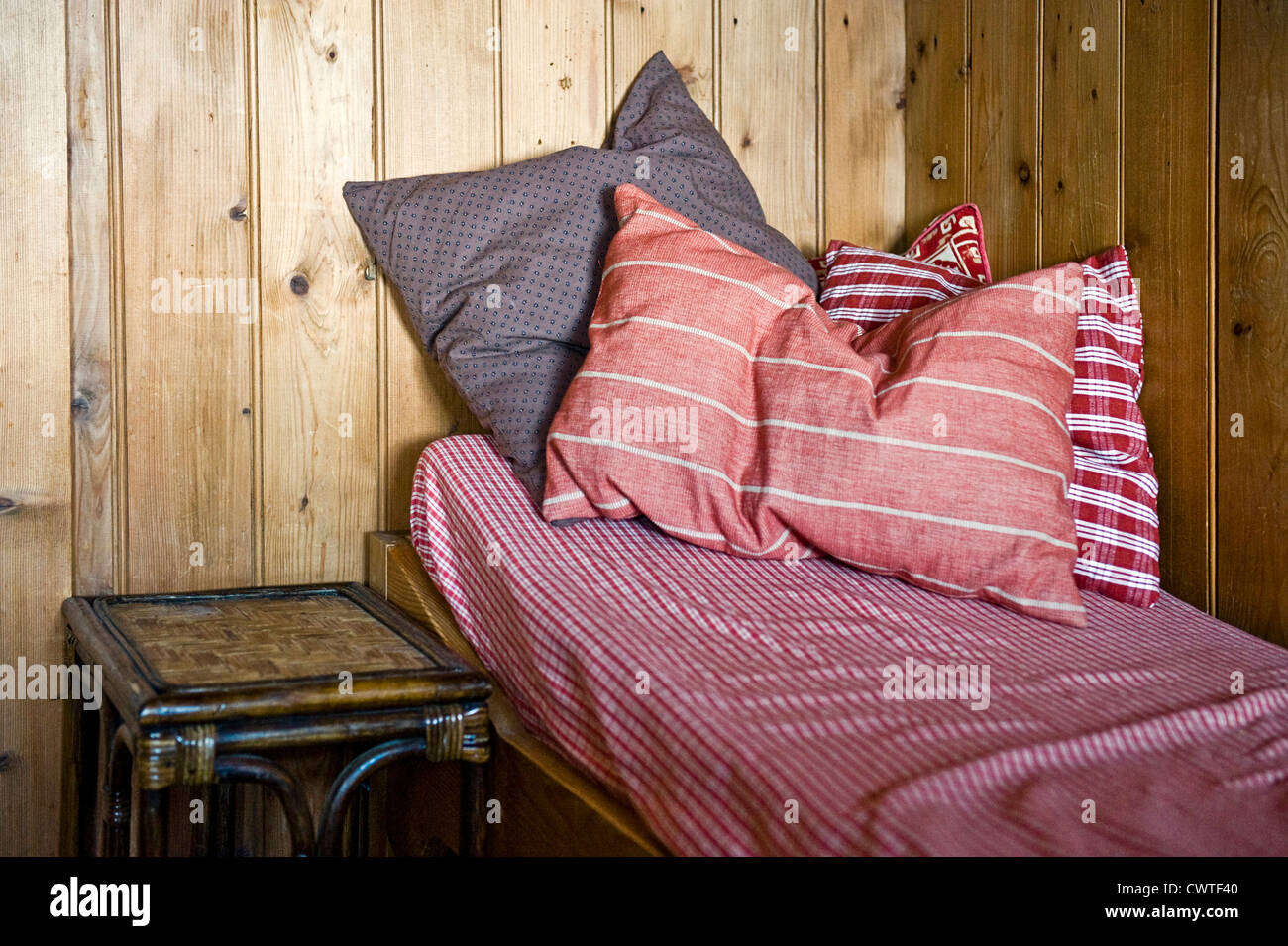 Bed in a stark room Stock Photo