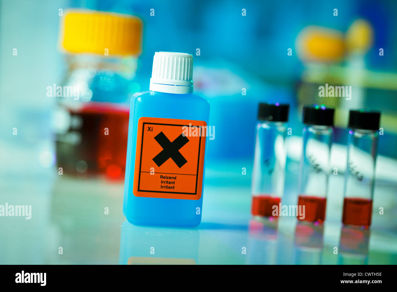 Dangerous substance in a plastic container on laboratory table Stock