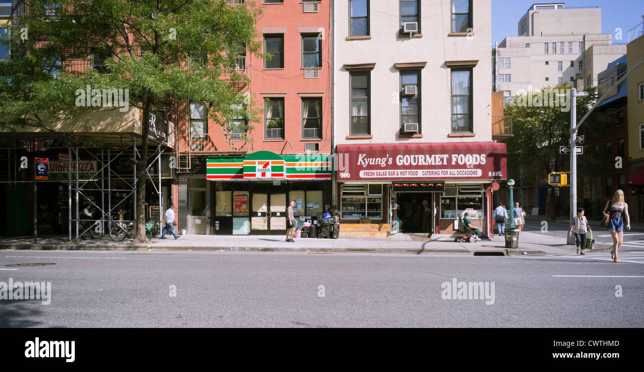 A 7-Eleven store about to open next to a Korean deli in the Chelsea neighborhood in New York Stock Photo