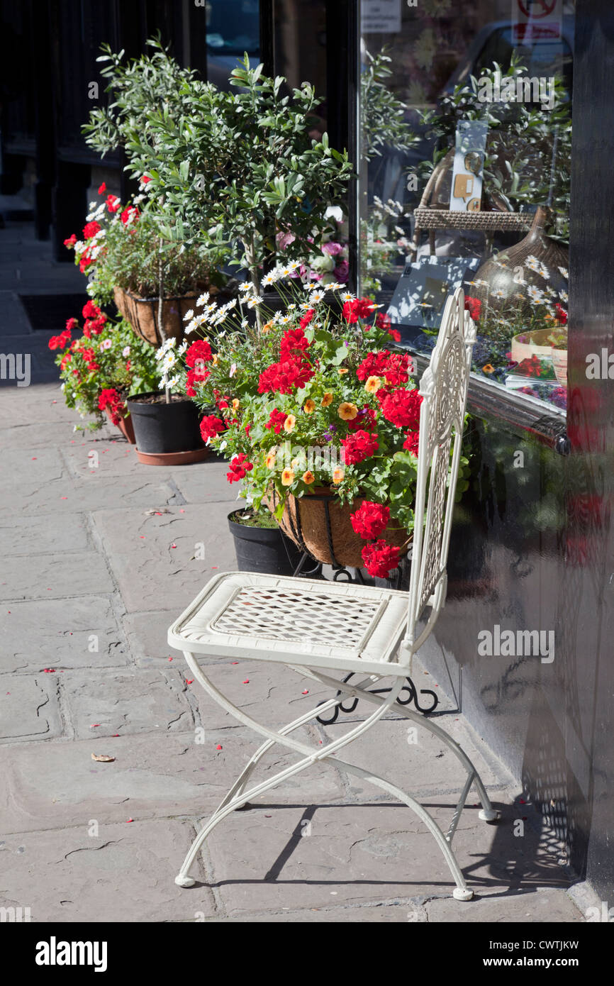 Floral display outside a shop in Bradford on Avon, Wiltshire, England, UK Stock Photo