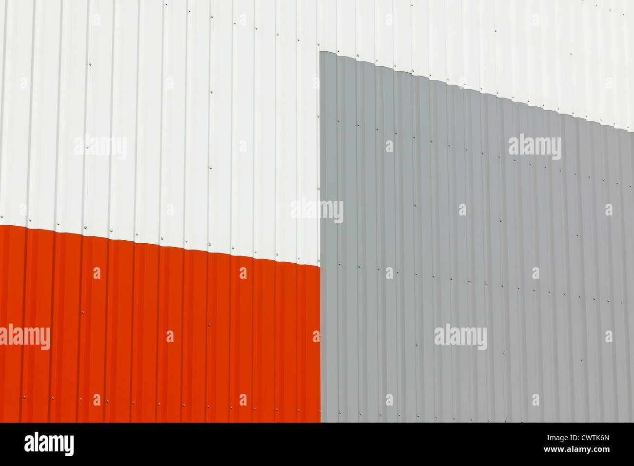 Brightly colored industrial warehouse exterior wall as background Stock