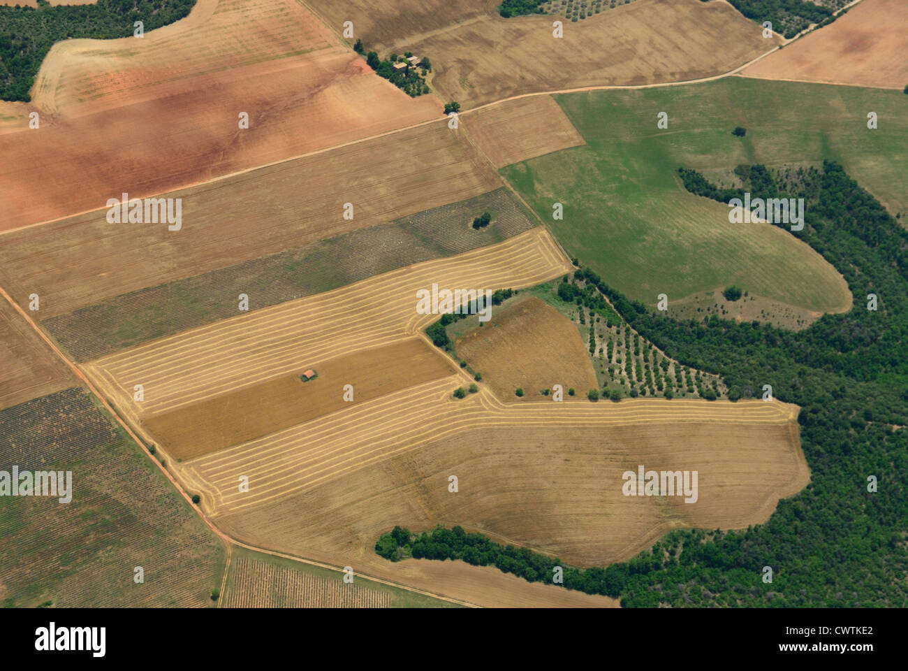 Aerial view of Cordeil farmland with wheat harvest, North of Valensole town, plateau Valensole, Alpes de haute Provence, France Stock Photo