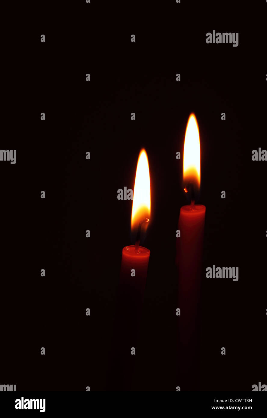 burning candle on black background Stock Photo - Alamy