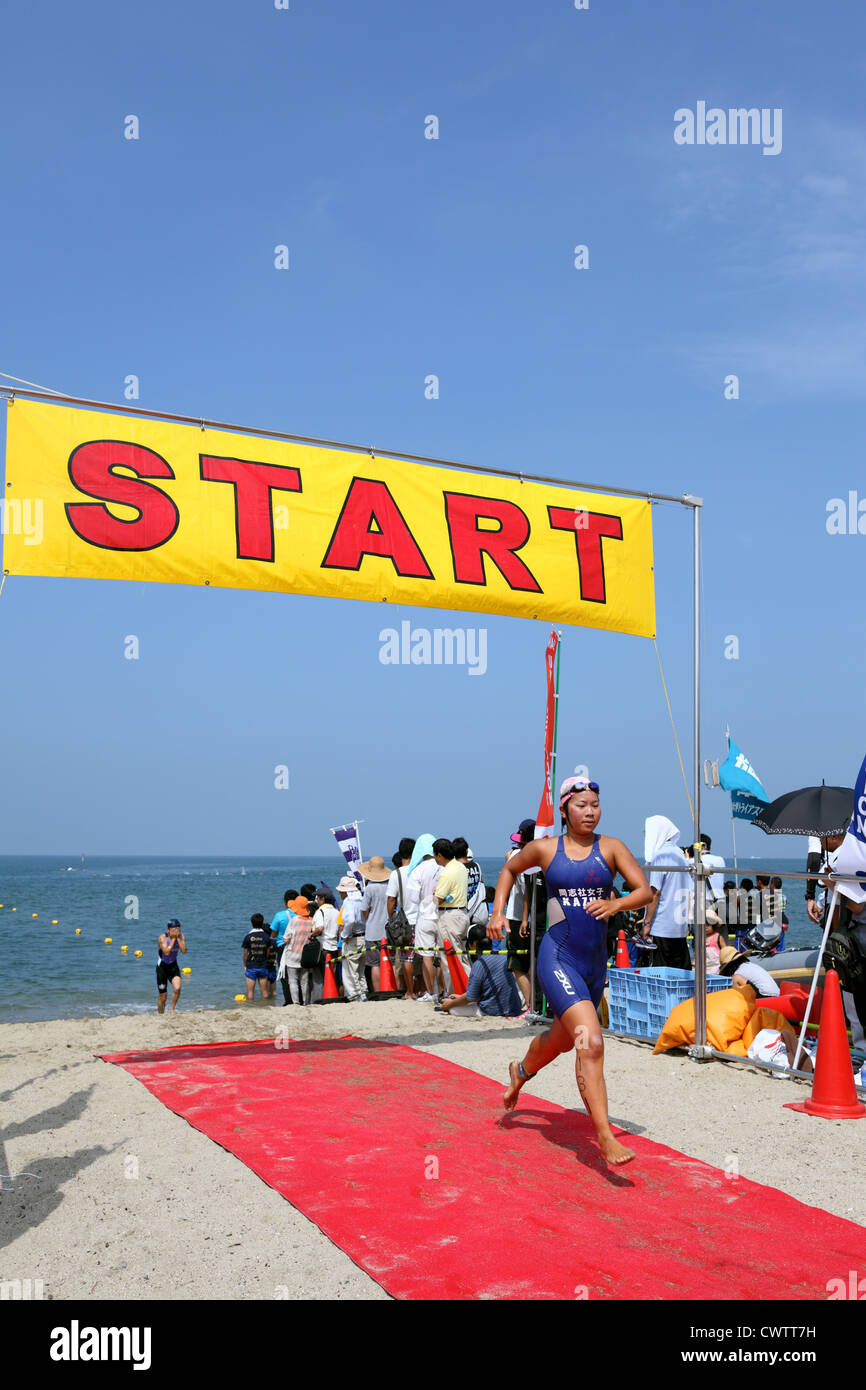 Triathlon race at the start of the beach Stock Photo Alamy
