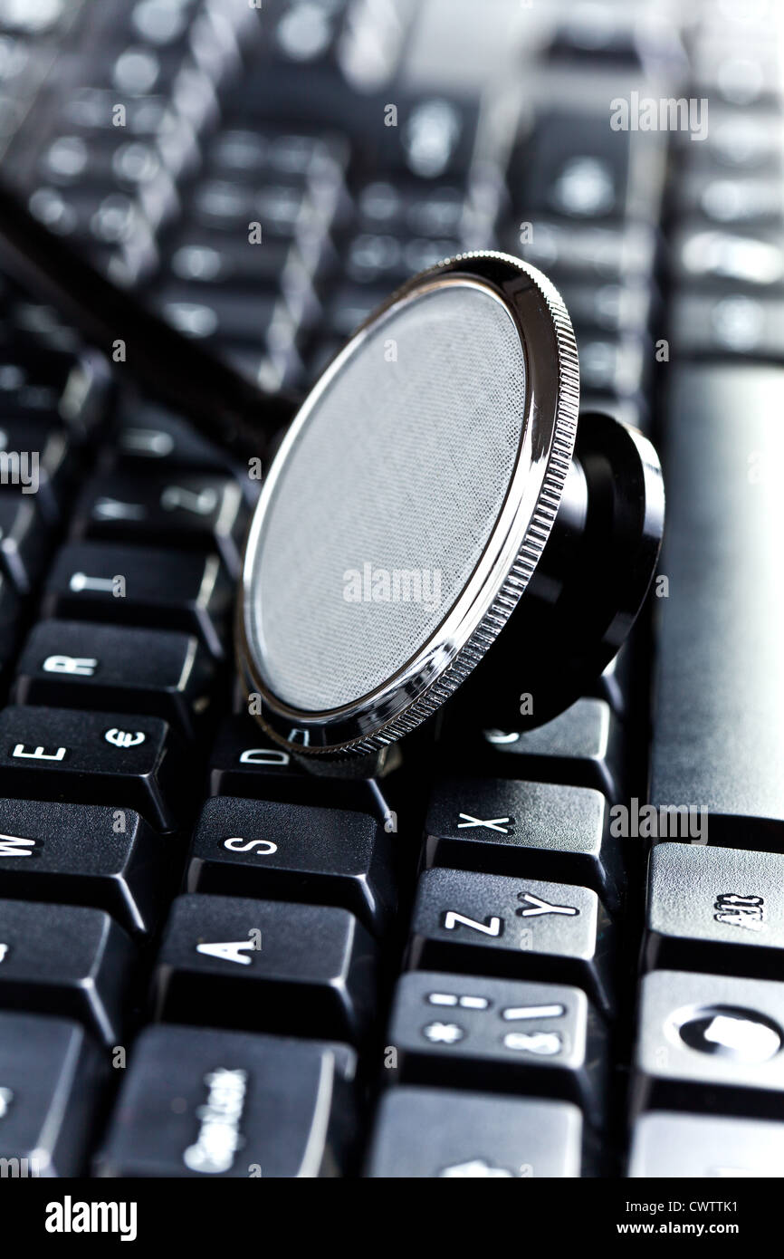 detail of medical stethoscope on computer keyboard Stock Photo - Alamy