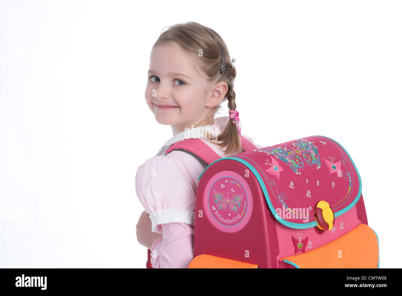 Smiling girl with schoolbag on her back Stock Photo