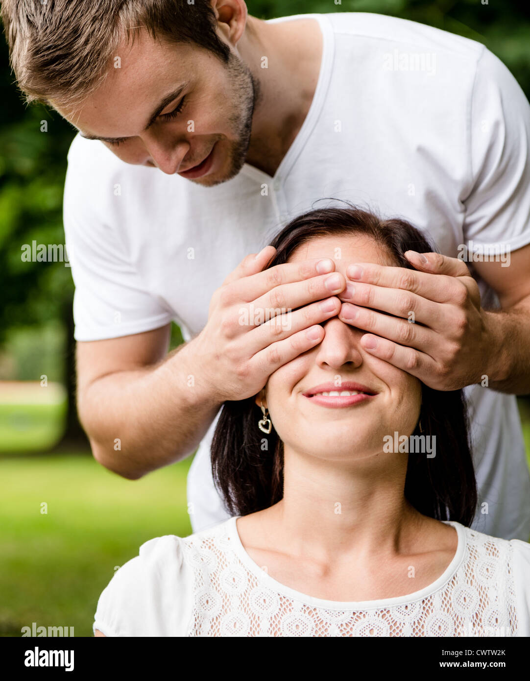 Young man covering eyes of her girlfriend Stock Photo Alamy
