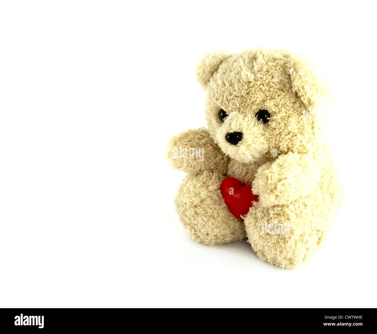 teddy bear toy with heart on white background Stock Photo - Alamy