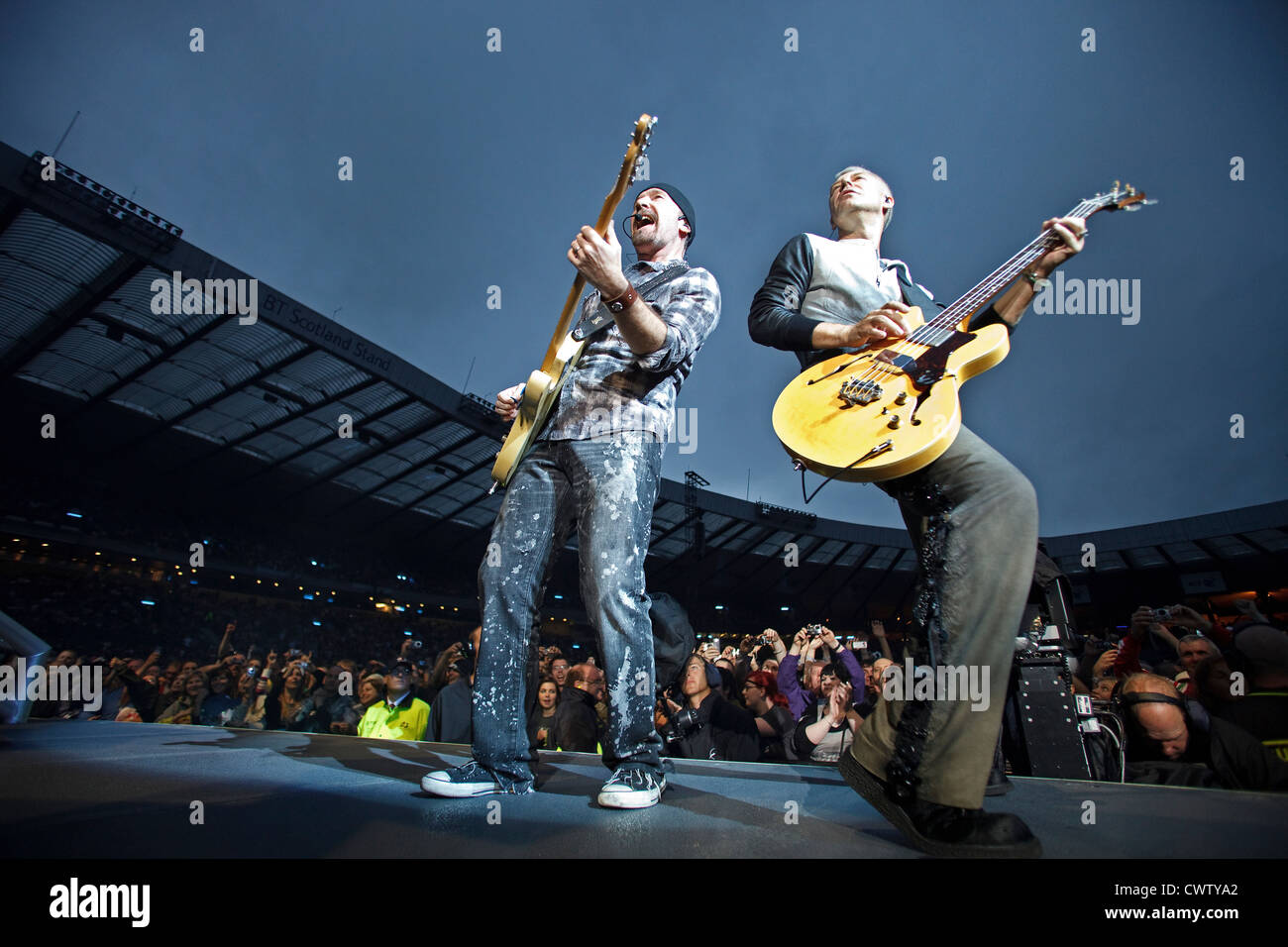 The Edge and Adam Clayton performing during The U2 360° Tour at Hampden Park, Glasgow, Scotland. Stock Photo