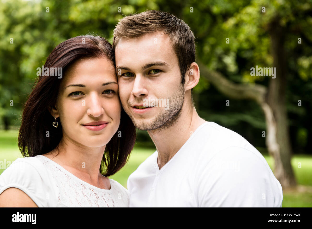 Outdoor portrait of young beautiful happy smiling couple Stock Photo ...