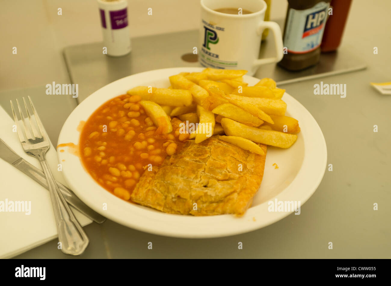 A plate of pasty chips and beans at a greasy spoon truckers cafe, UK