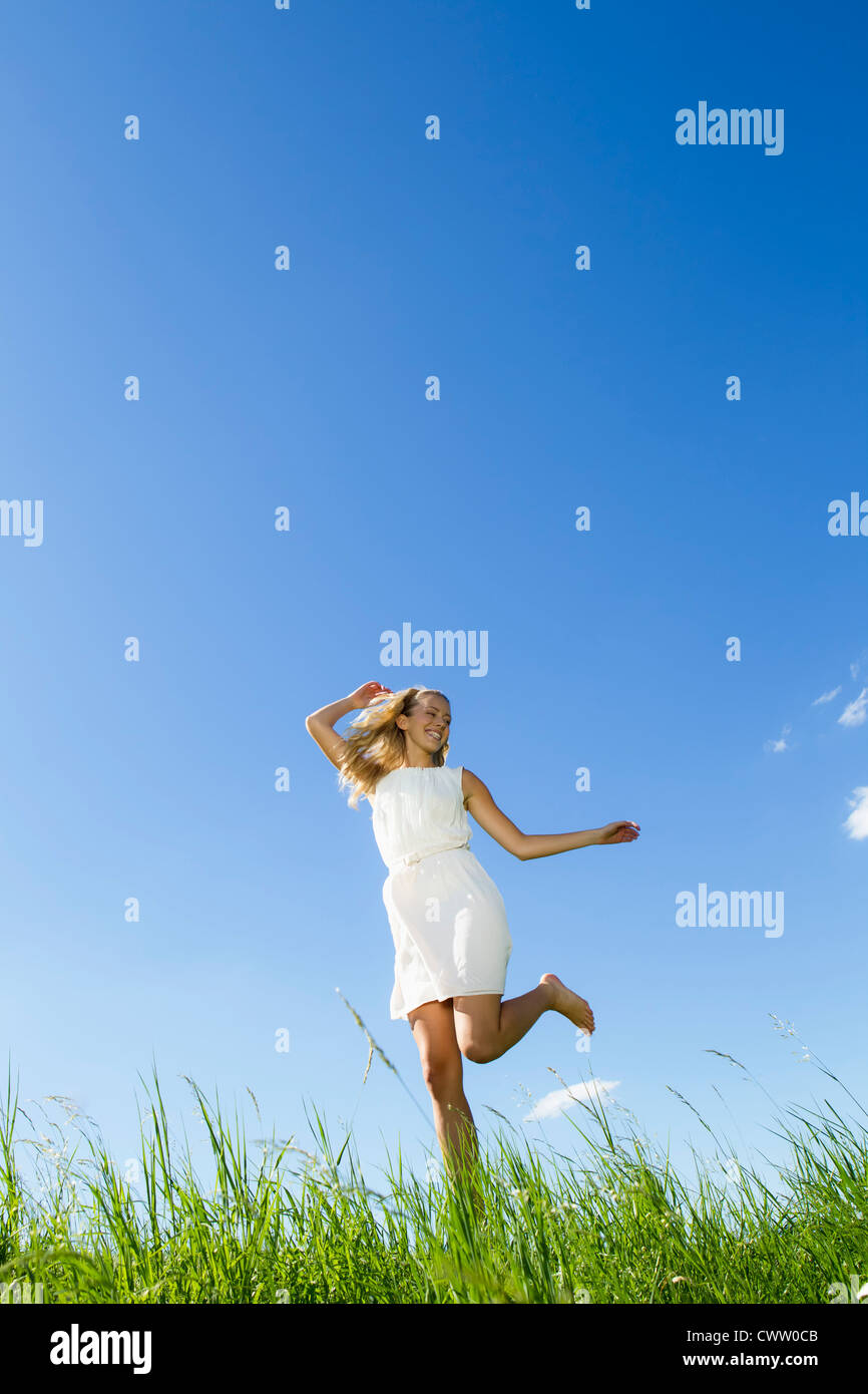 Female walking barefoot in grass hi-res stock photography and images ...