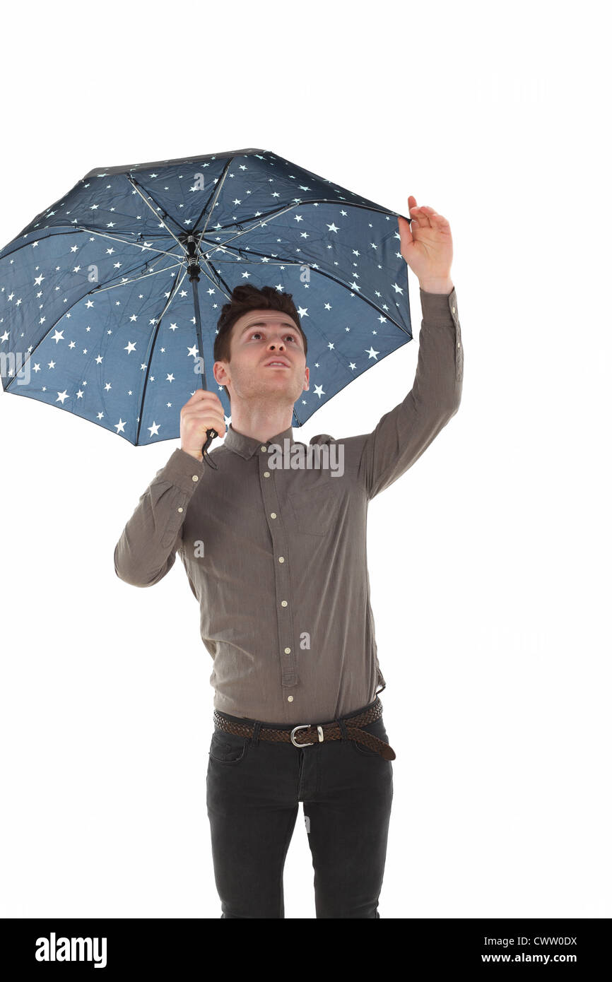 Handsome man with a blue umbrella with stars Stock Photo - Alamy