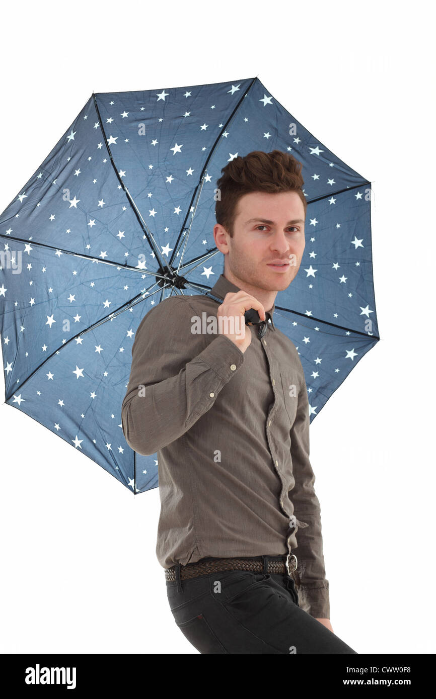 Handsome man with a blue umbrella with stars Stock Photo - Alamy