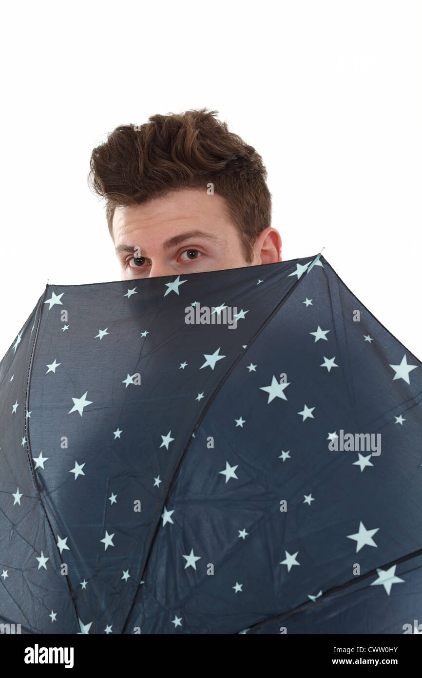 Handsome man with a blue umbrella with stars Stock Photo - Alamy