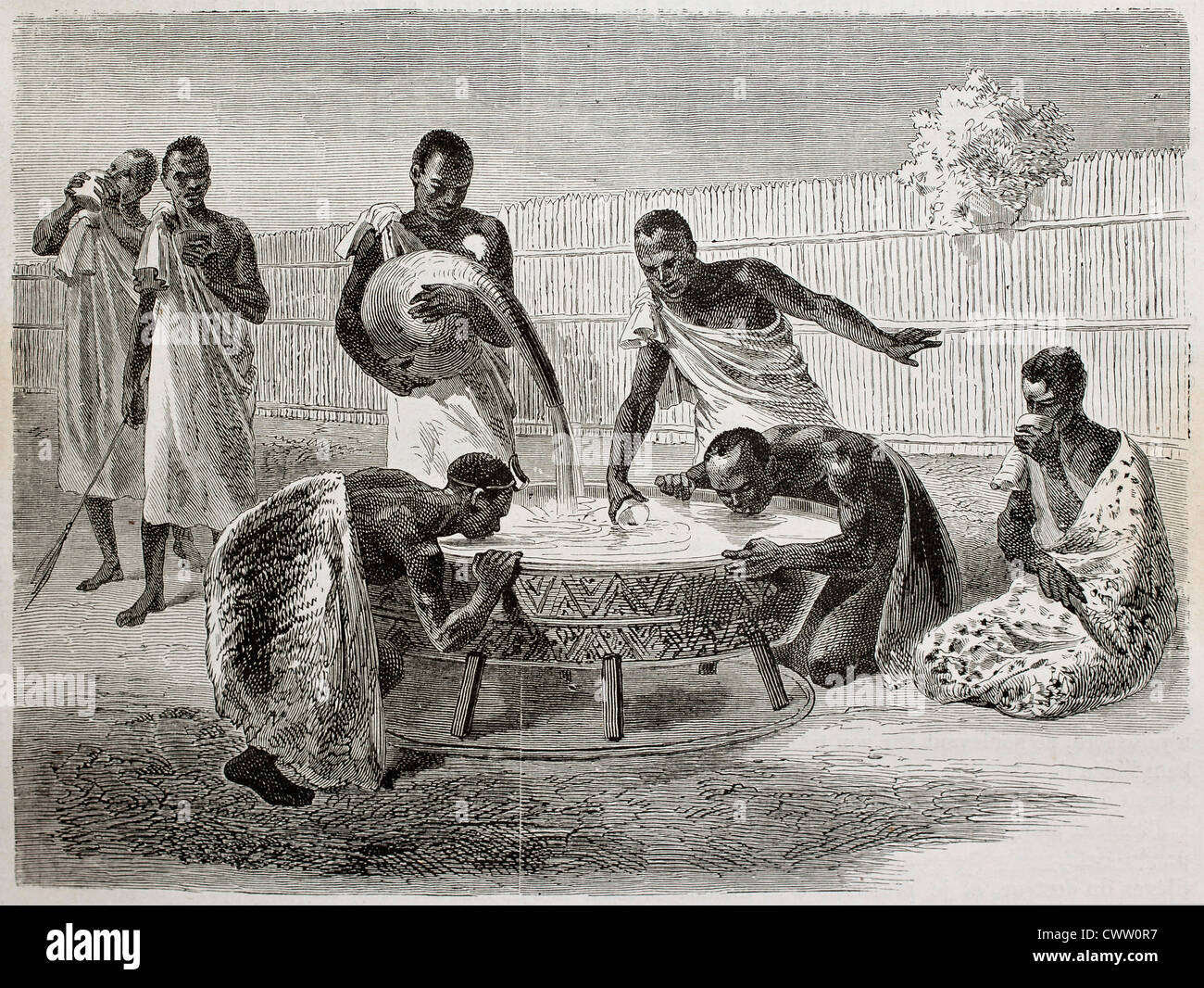 native Ugandan Africans drinking millet beer Stock Photo Alamy