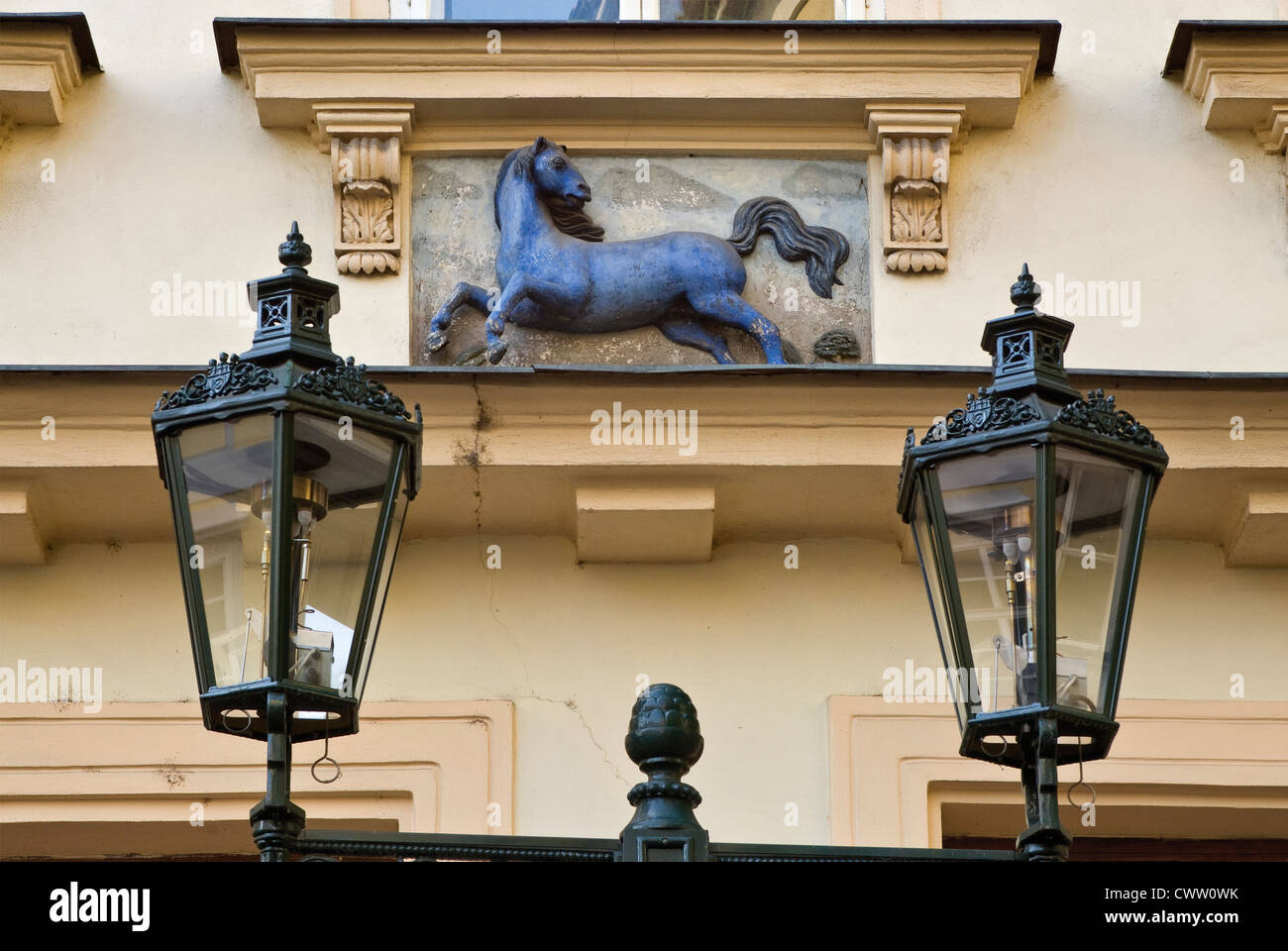 Old gas lanterns and Blue Horse sign on house at Male Namesti in Old Town, Prague, Czech Republic Stock Photo