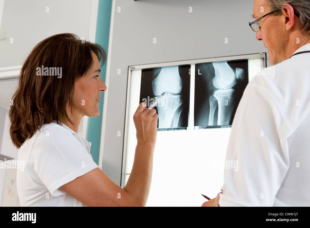 Doctor and nurse examining x-rays Stock Photo