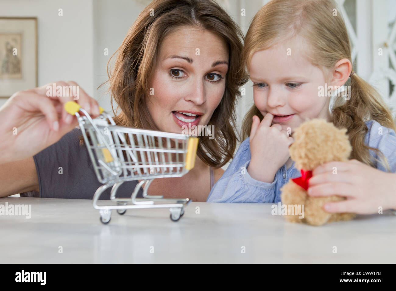 Mother and daughter playing with toys Stock Photo