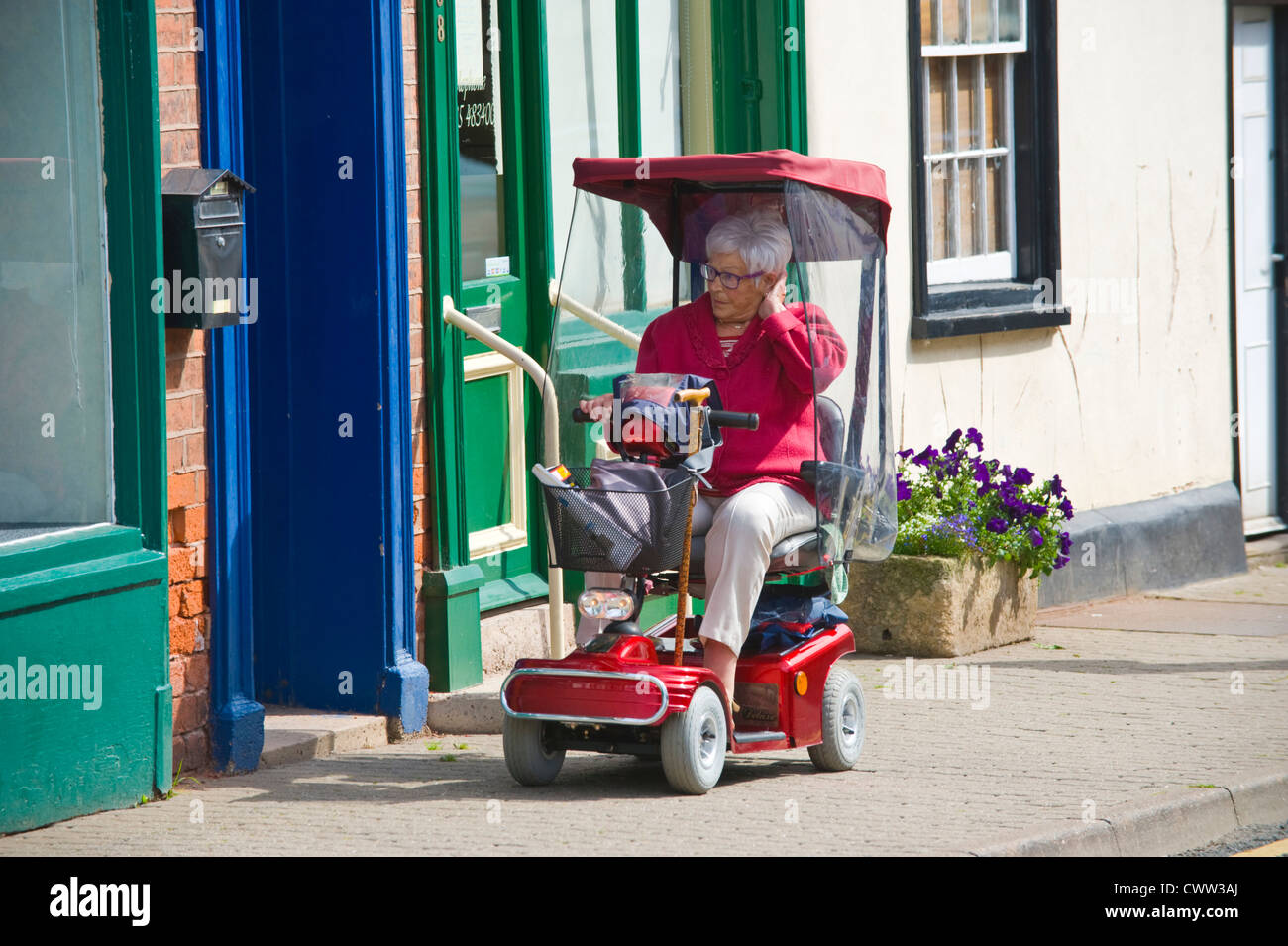 Old lady riding mobility scooter hires stock photography and images Alamy