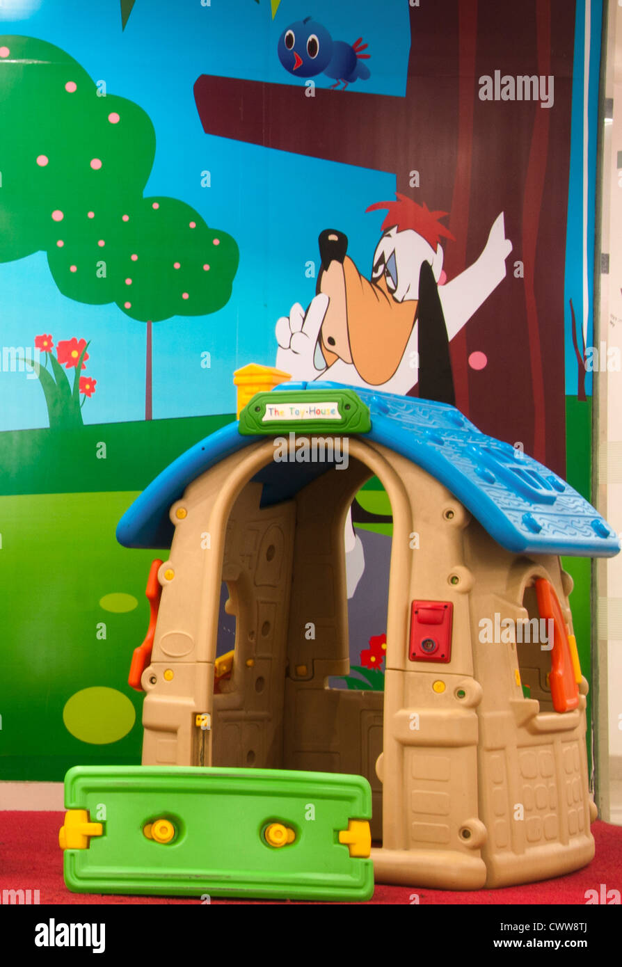 Toy house and slide in kindergarten, preschool Stock Photo