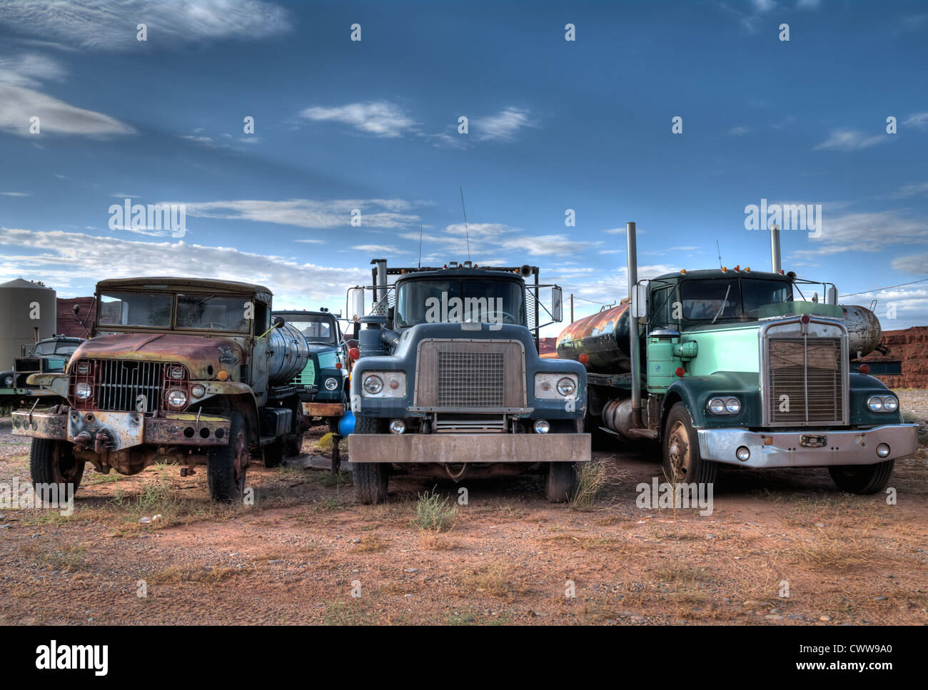 Junkyard three trucks standing in hires stock photography and images