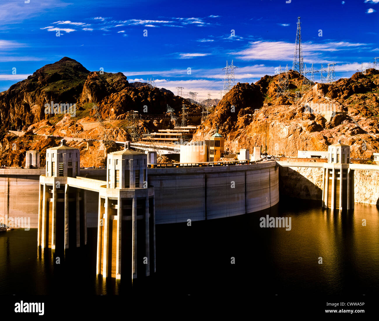 Hoover Dam straddles the mighty Colorado River, which forms the border between the states of Nevada and Arizona. Stock Photo