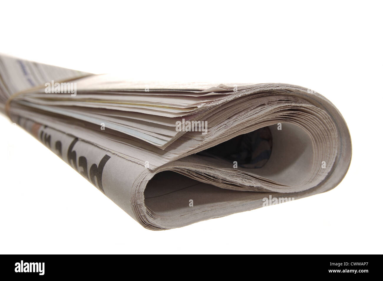 Rolled up newspaper on a white backgrund Stock Photo Alamy