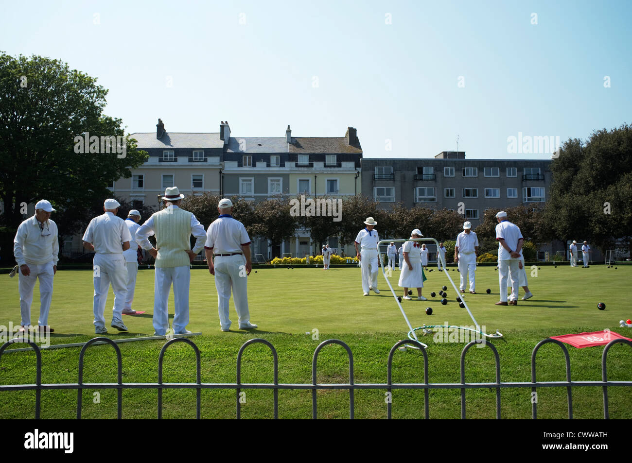 A group of people playing bowls at a club at Plymouth Hoe, Devon, England, UK. Stock Photo