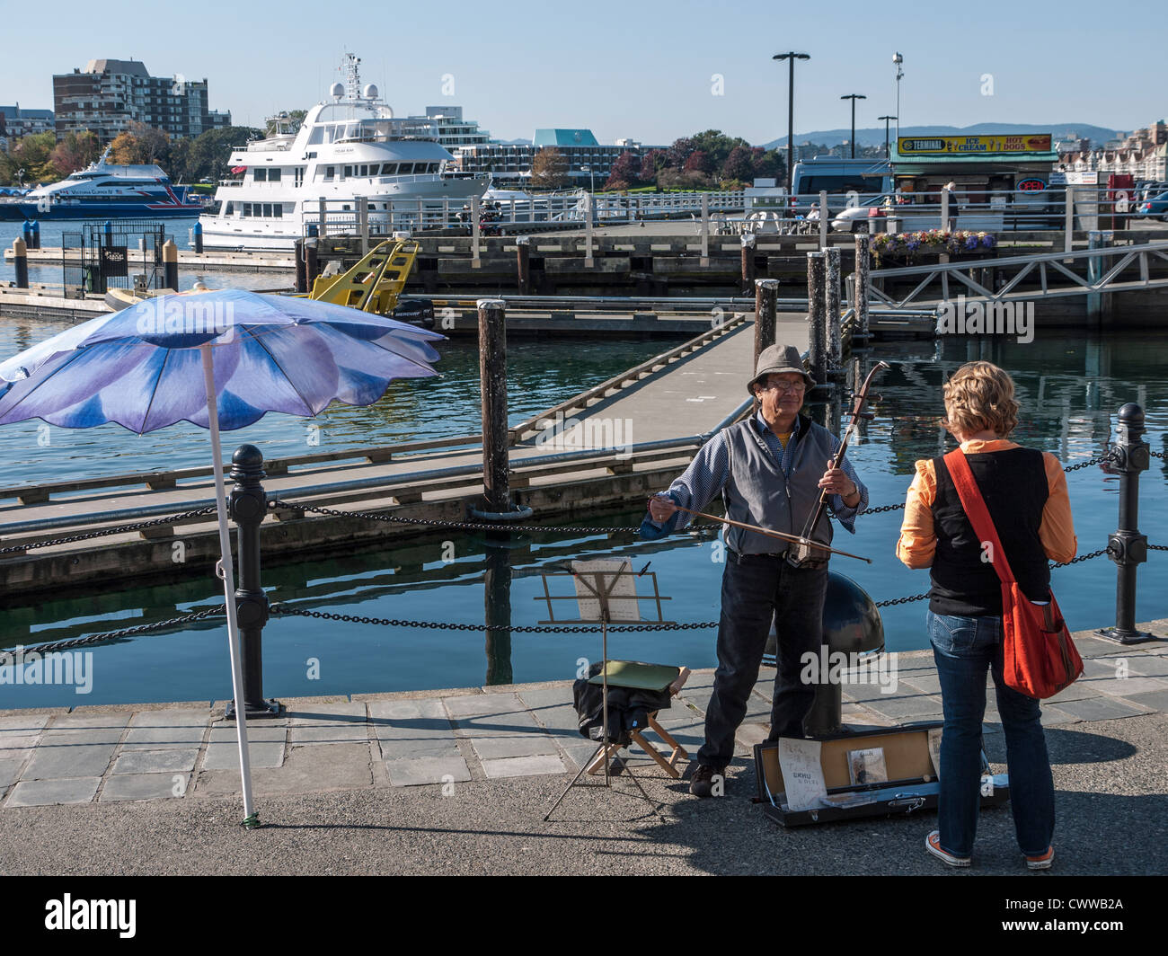 Musician playing an erhu, a chinese musical instrument on the waterfront, Victoria, British Columbia, Canada Stock Photo