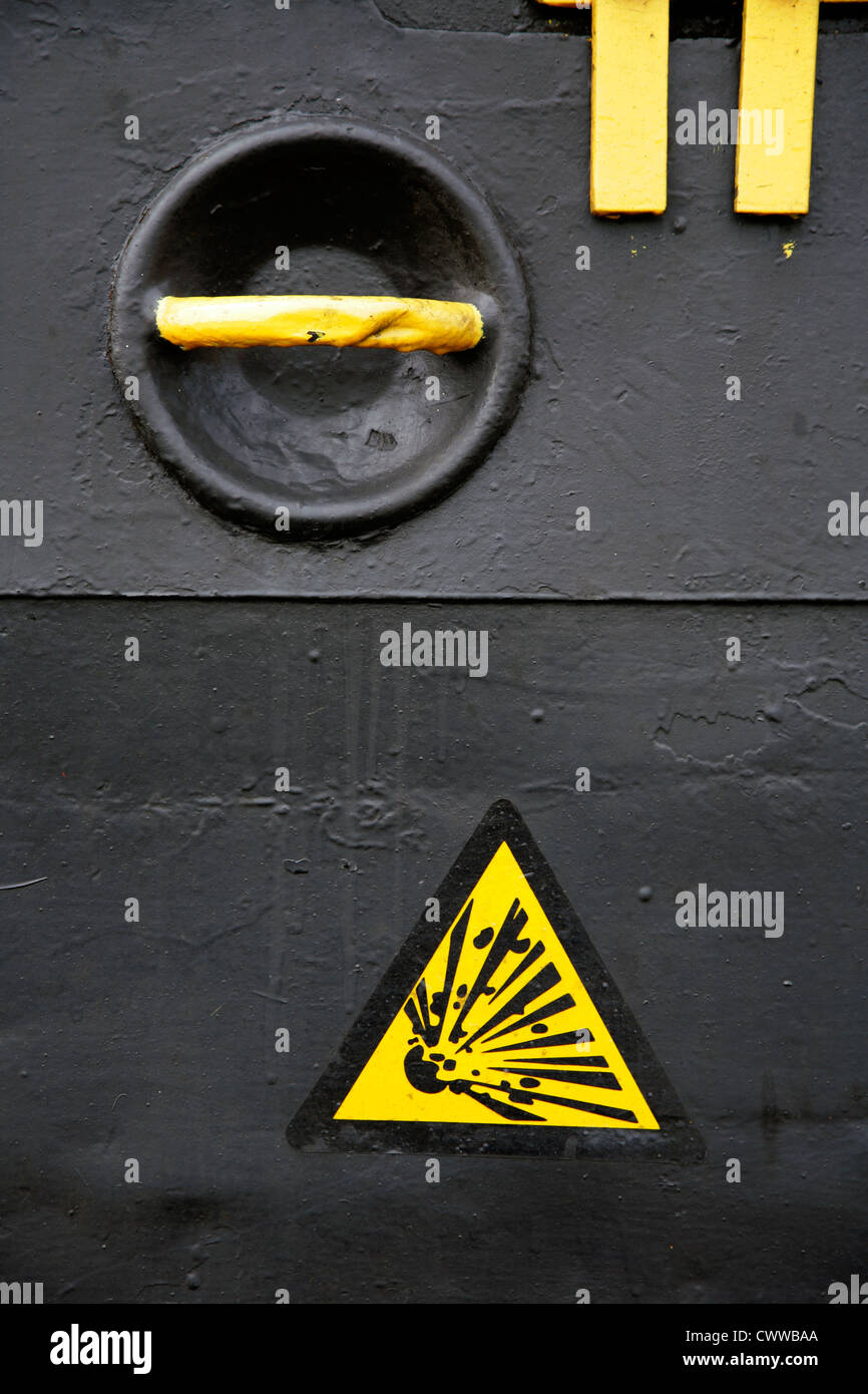'Risk of Explosion' warning sign on inspection panel. Stock Photo
