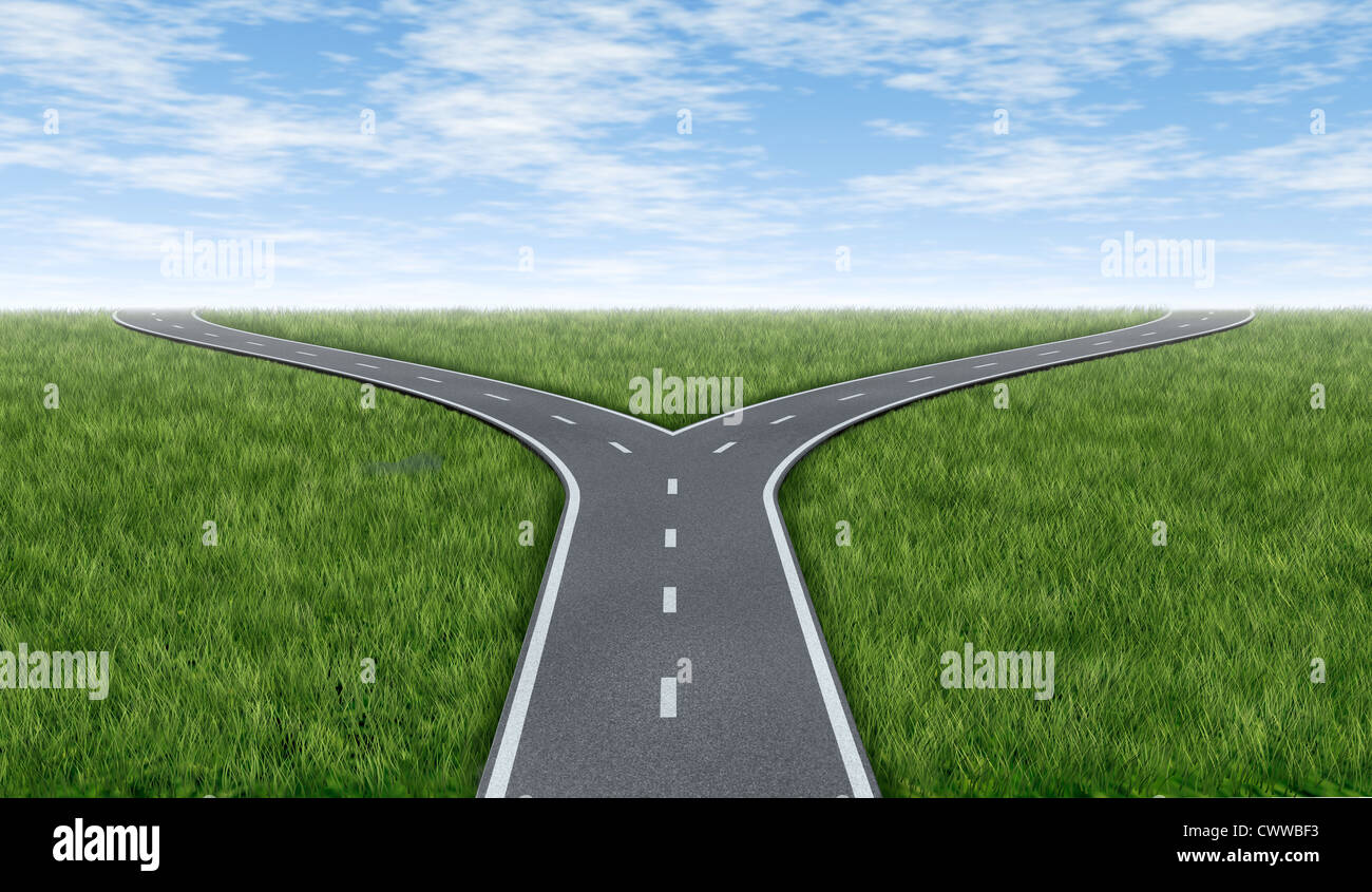 Cross roads horizon with grass and blue sky showing a fork in the road or highway business metaphor representing the concept of Stock Photo