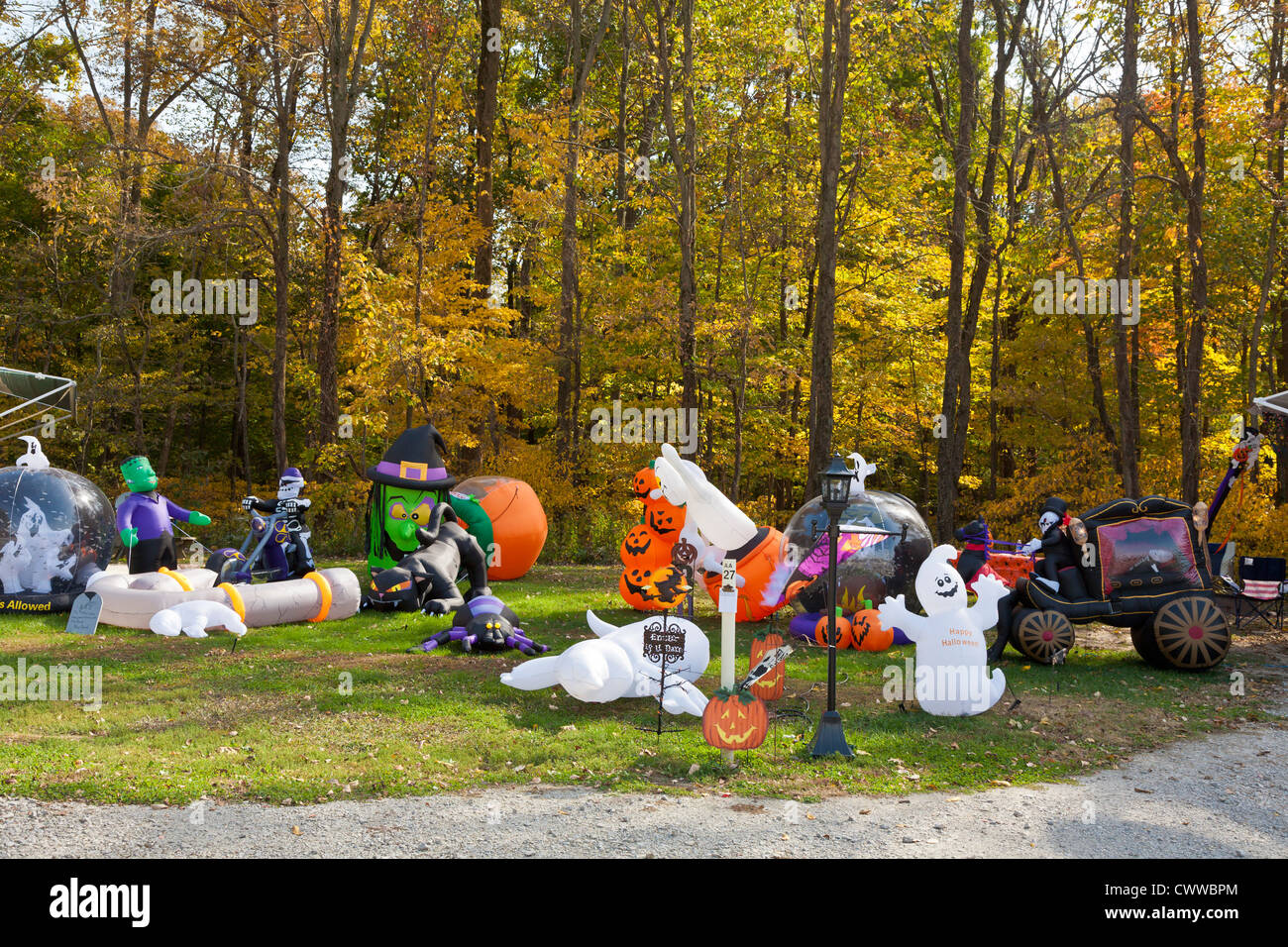 Inflatable Halloween Decorations On Lawn In Front Of Brightly