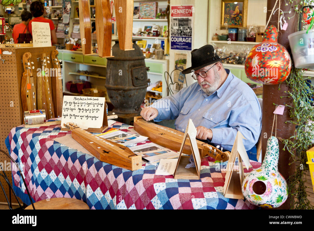 Man plays and sells hand made dulcimers at Billie Creek Village in