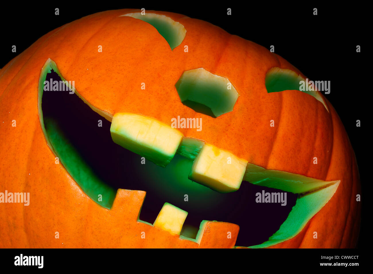 grinning illuminated pumpkin Stock Photo