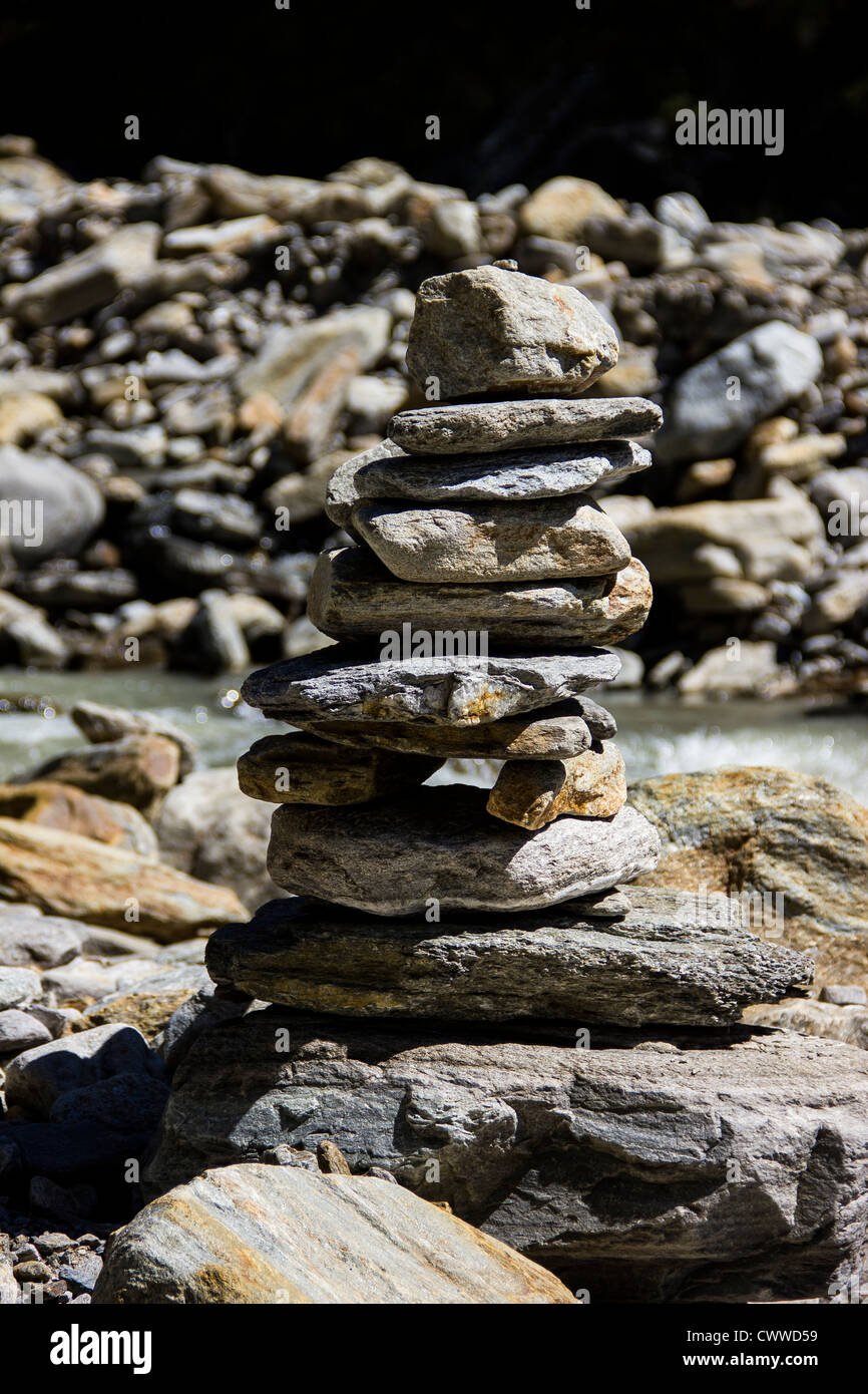 pebble stack in balance near a stream Stock Photo - Alamy