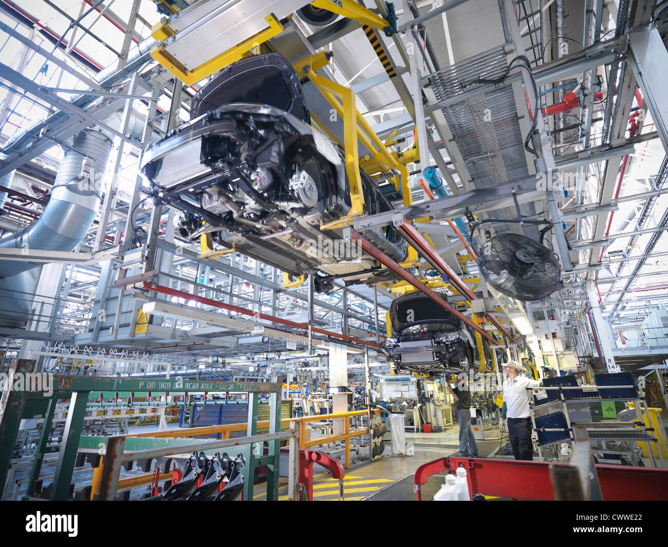 Workers on car production line in car factory Stock Photo Alamy
