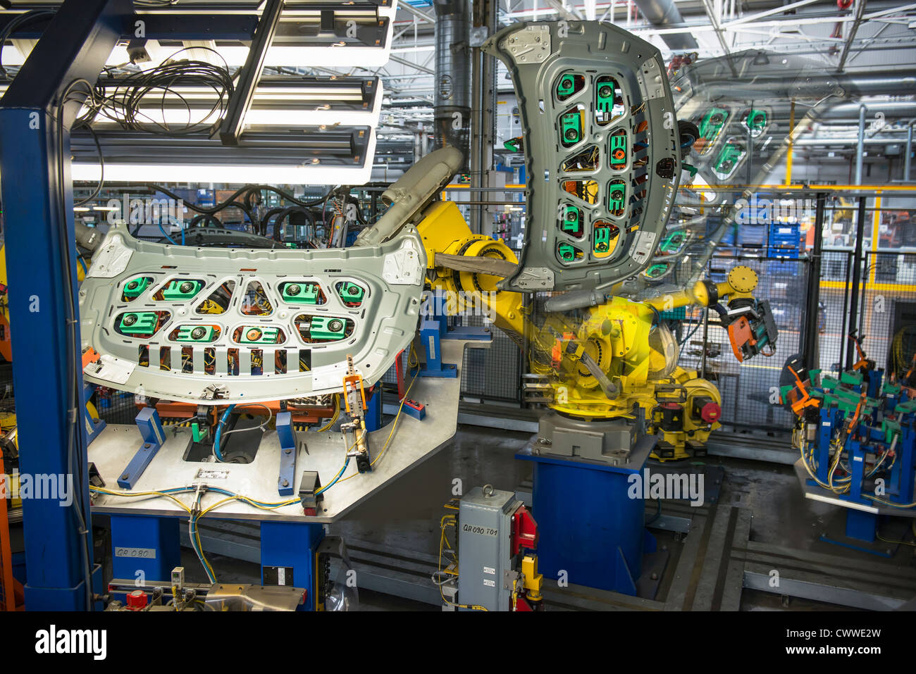 Robots handling car parts in car factory Stock Photo Alamy