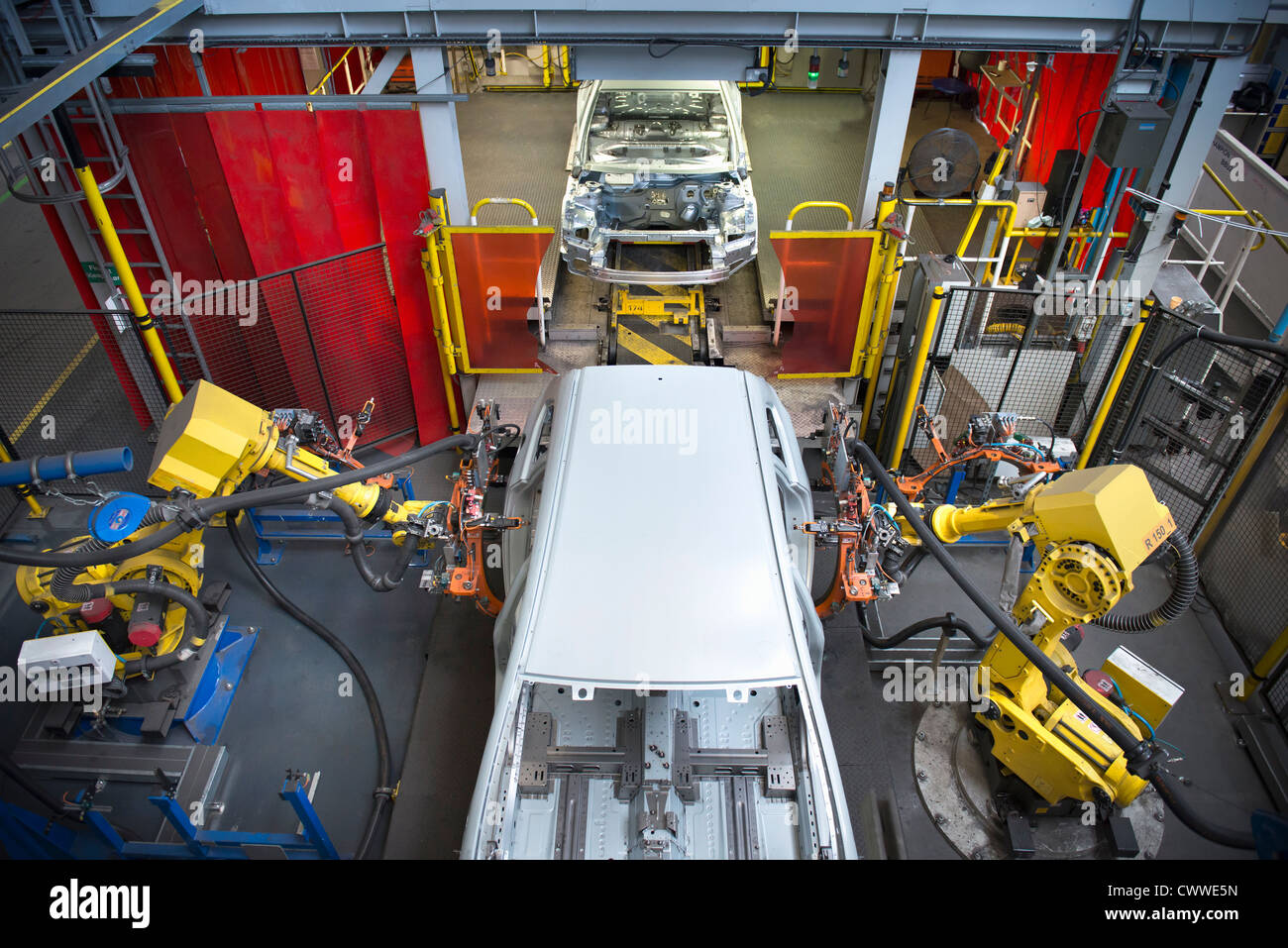 Car bodies on measuring machine in car factory Stock Photo Alamy