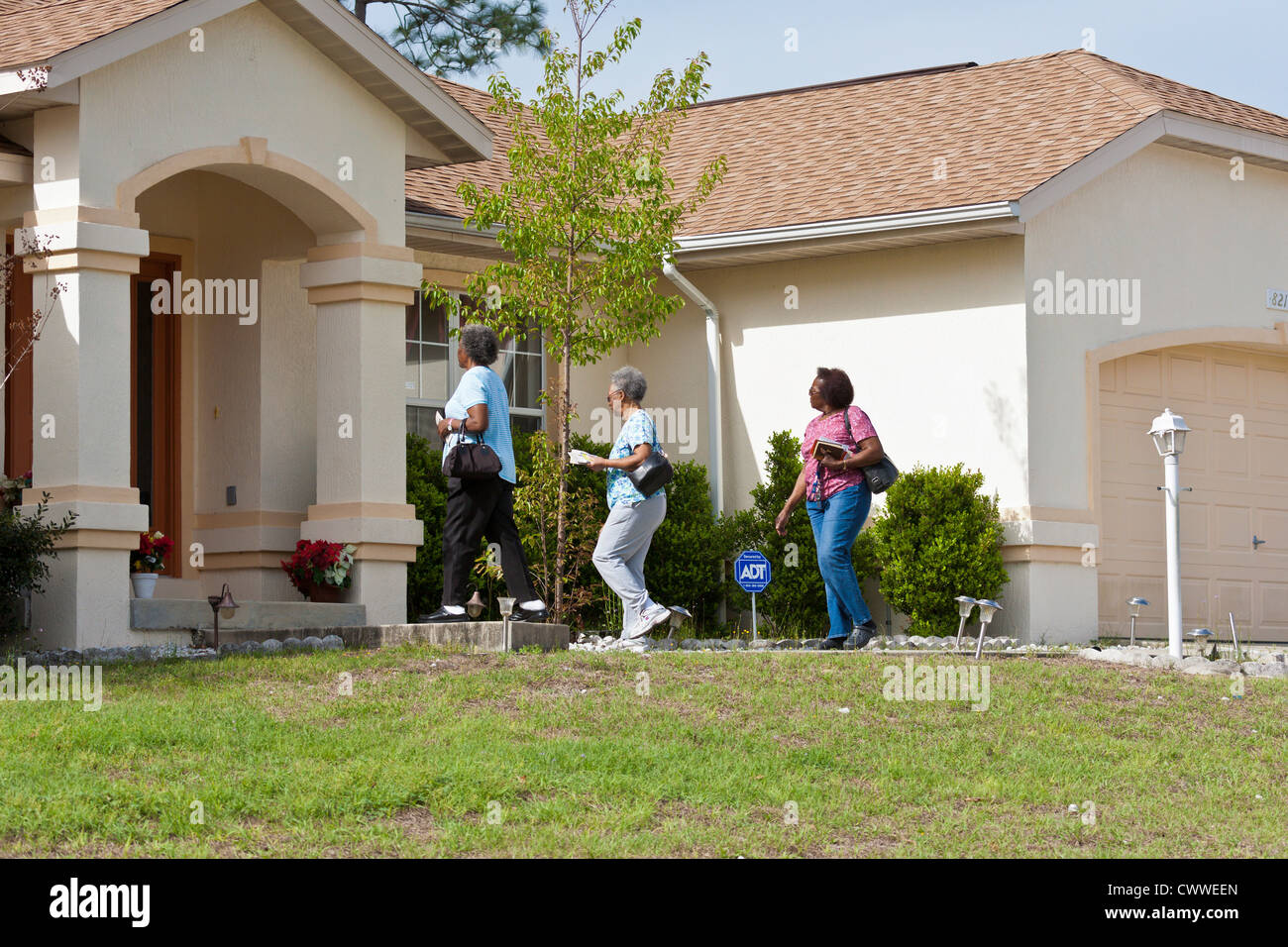 Evangelism Team Walk Door To Door To Spread The Word Of God In