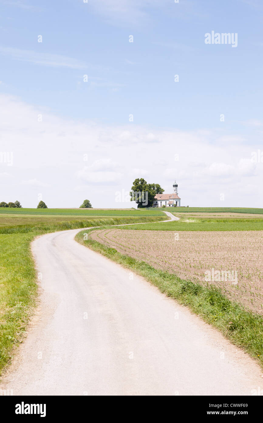 Dirt road in rural landscape Stock Photo