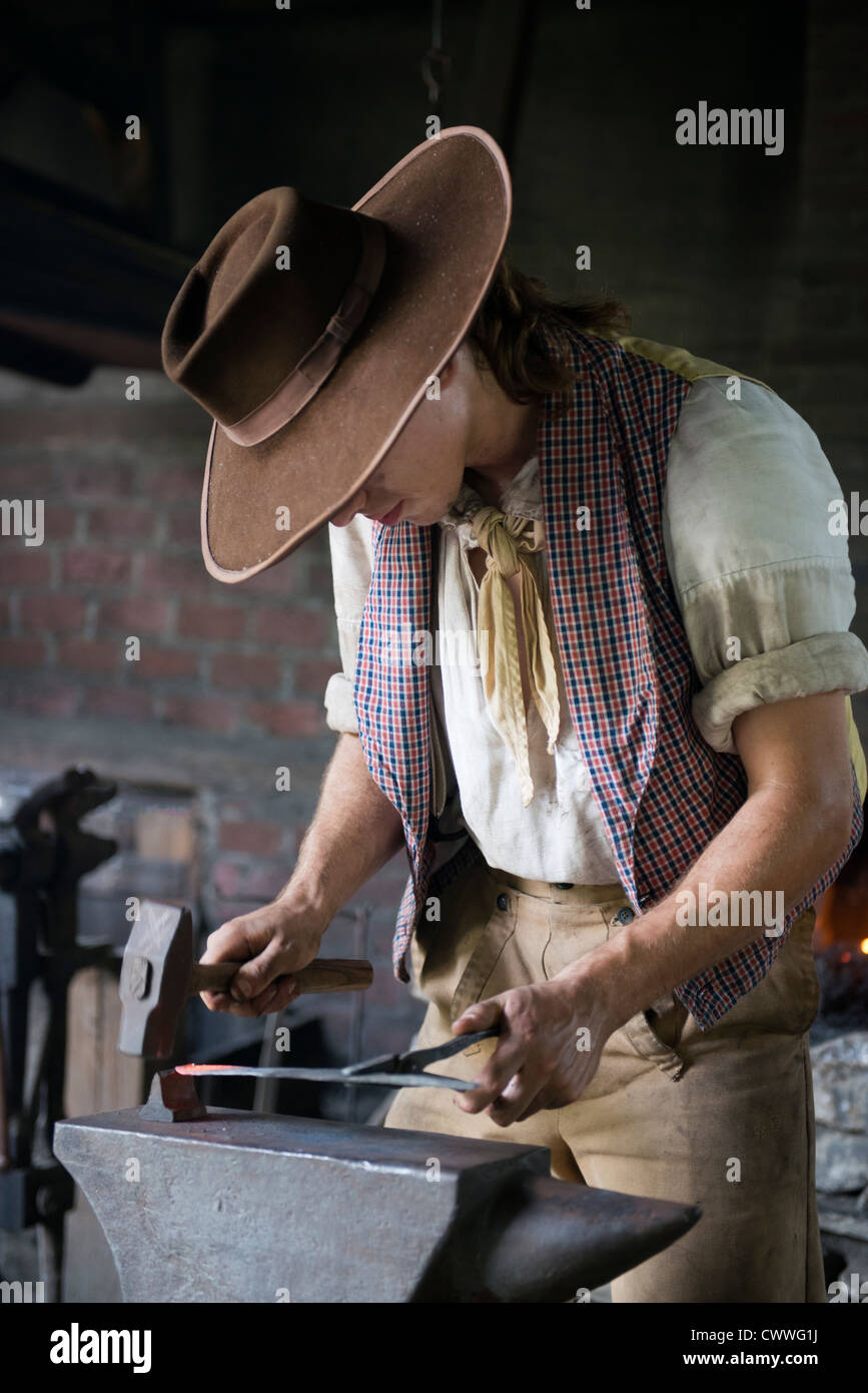Blacksmith making a knife using traditional methods Stock Photo Alamy