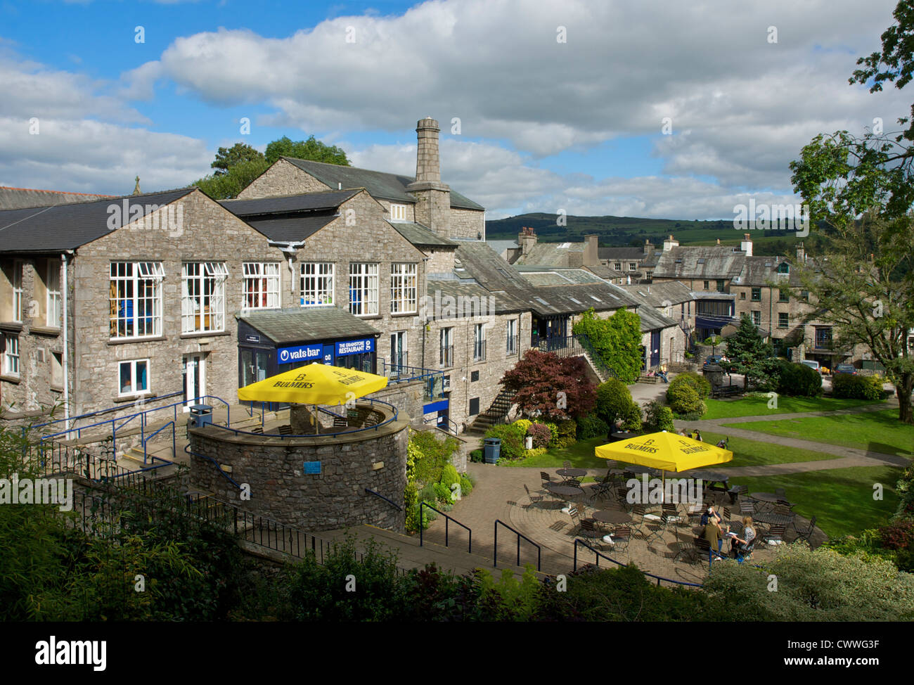 People sitting outside the Old Brewery Arts Centre, Kendal, Cumbria, England UK Stock Photo