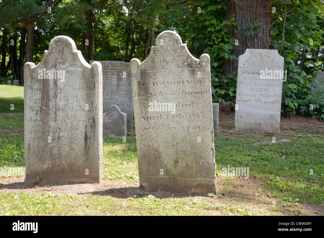 Weathered gravestones in a cemetery. Stock Photo