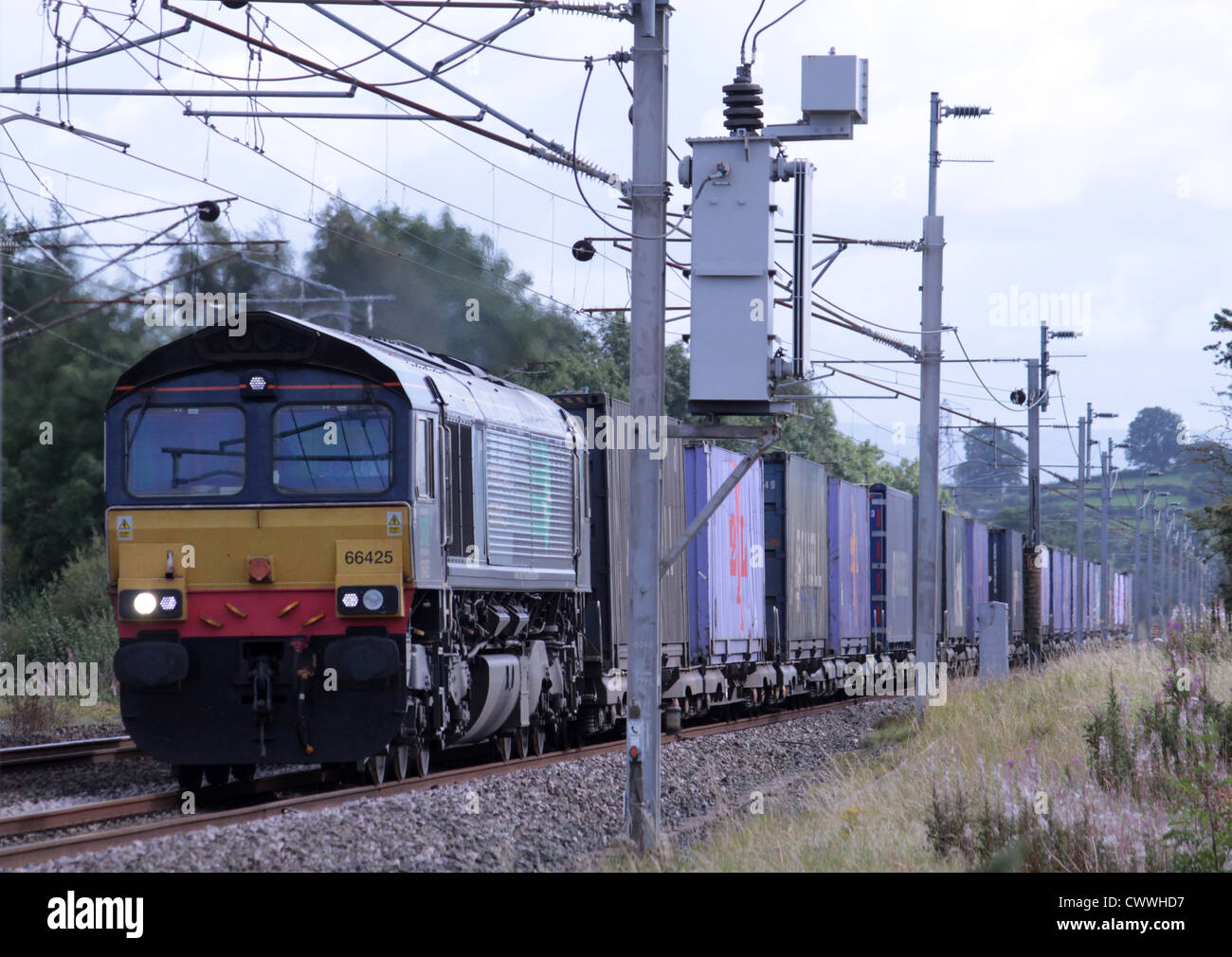 DRS liveried class 66 diesel hauling a container train on