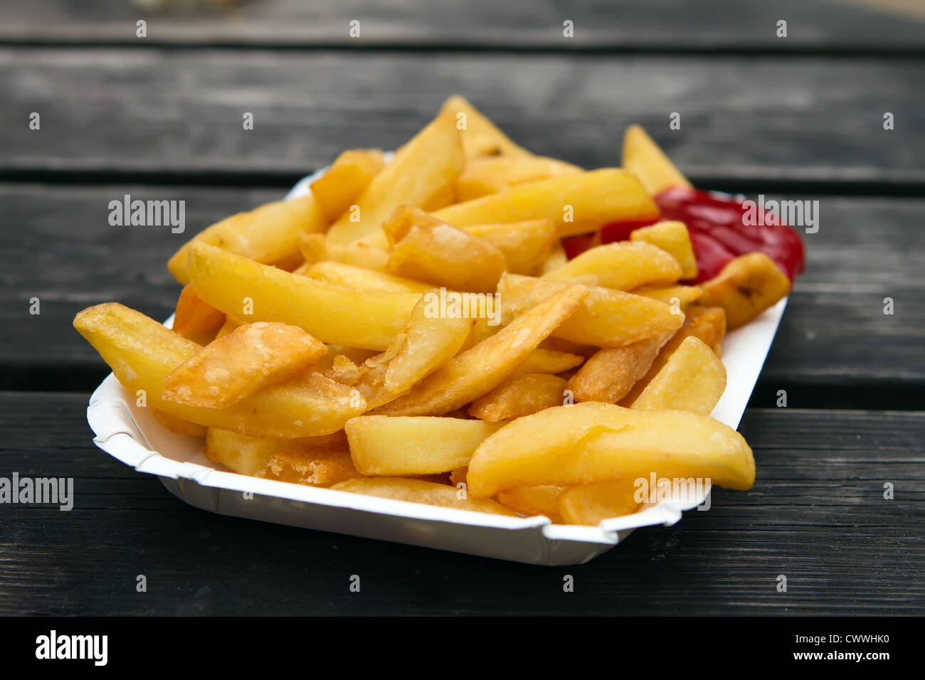 portion of takeaway chips in a white container Stock Photo Alamy