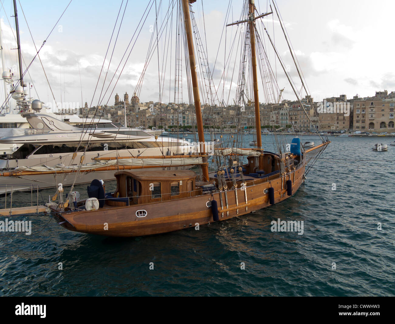 Traditional wooden sailing boat in the Grand Harbour Valletta, Island of Malta, Mediterranean Stock Photo