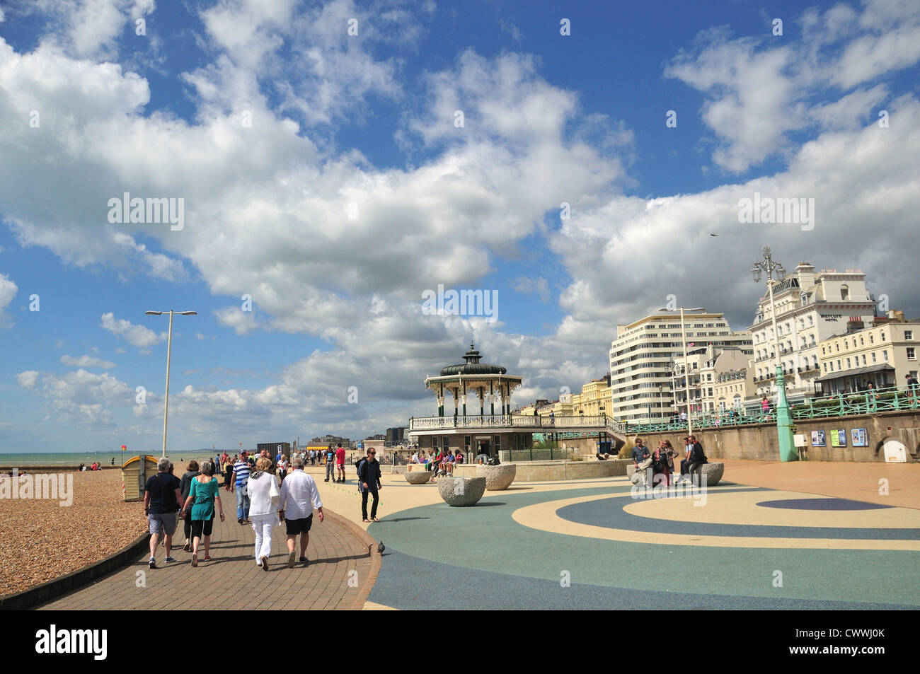 Busy Brighton and Hove seafront in summer (with the Brighton Bandstand
